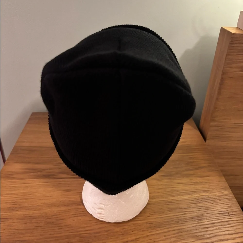 Kids black beanie with a bear wearing a red hat